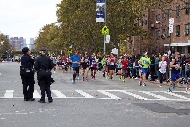 The intersection of East 138 Street and Alexander Avenue in the South Bronx was busy with participants in the 2015 New York City Marathon who ran through on their way towards Central Park and the finish line. Photo by Elizabeth Arakelian