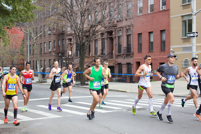 The New York City Marathon runners pushed through Harlem as they came to mile twenty-three with only three miles separating them from the finish line. By Astrid Hacker