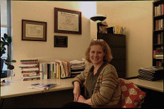 Dr. Caryn Medved sits in her office at Baruch College and explains her recent studies on stay-at-home fathers. Photo by Alex Zuccaro