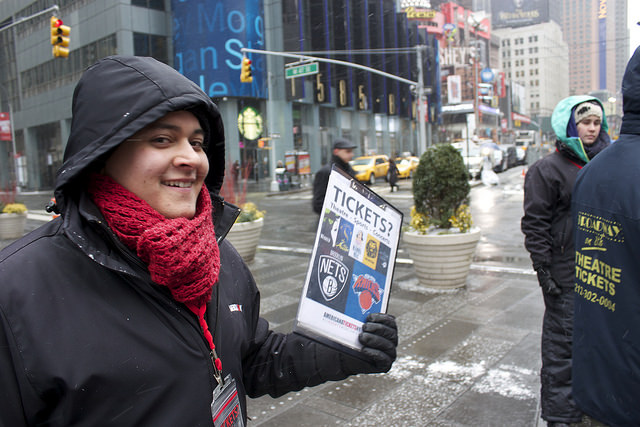 Stephen Velasquez of Washington Heights attempts to sell tickets to tonight's broadway shows in Times Square despite looming blizzard conditions. Photo credit: Megan Jamerson