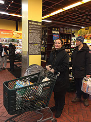 Mary Vays ,42,  waits on a long line for the cash register at Fairway Market on second avenue. Photo Credit: Ben Shapiro