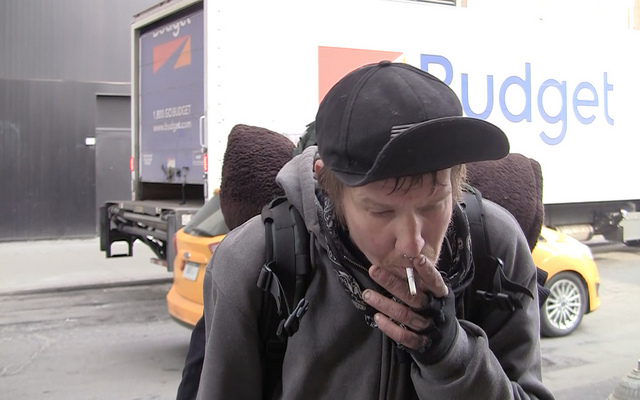 Nicols smokes a cigarette while explaining what he and his homeless friends are going to do to stay warm during this Valentines Day weekends icy weather outside of Starbucks Astor Place.  Photo by Rakeesha Wrigley