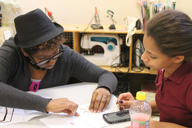 Laira Reid helps Kaylee Torres, 11, with a project at NYC Sparx in the South Bronx Photo by Karis Rogerson