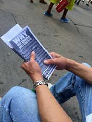 Claudio Marty displays a copy of the hundreds of pamphlets he gave out today. Photo by Eli Kurland