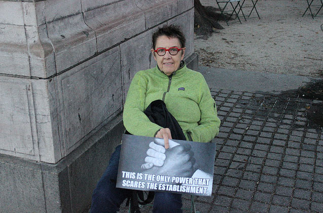 Mimi McDermott, 74, of the Upper West Side sat and waited for the rally to begin. She has been attending rallies and protests since the 1960s. Photo by Brandon Gomez.